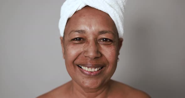 African senior woman smiling on camera - Beauty day and skin care therapy concept