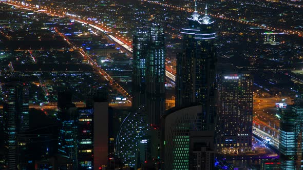 Dubai Cityscape Skyscrapers Panorama Night Time Lapse. Pan Up