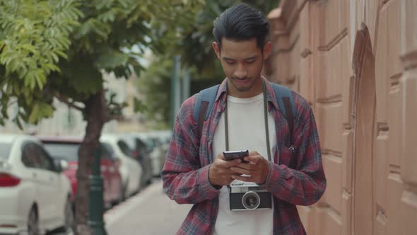 Young Asian man blogger happy enjoying leisure lifestyle travel.