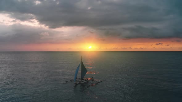 Traveler on Sailboat at Sunset Closeup Aerial