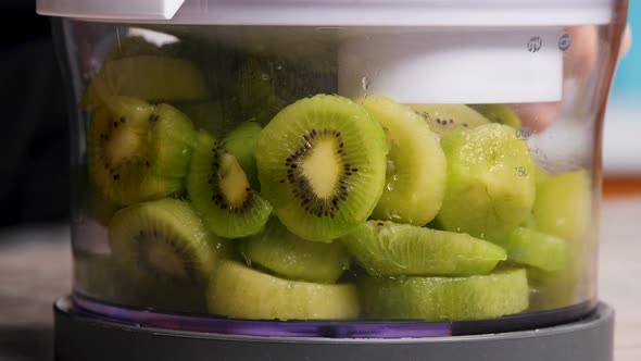 fresh kiwi in a blender, close-up