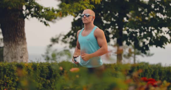 Handsome Man Running in the Park Training in the Summer / Videohive