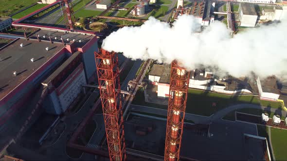 White smoke from the chimney of an industrial enterprise.