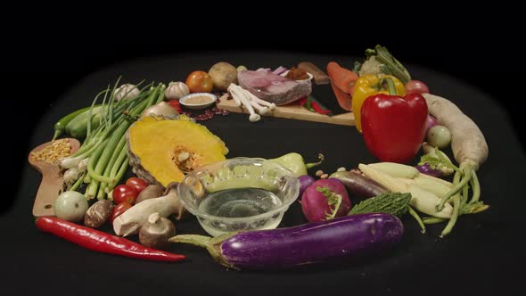 Fresh Fish Fillets With A Set Of Vegetables Placed On A Black Table.