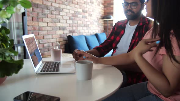 Young Indian Couple Chatting with Relatives Via Videoconference Videocall Application