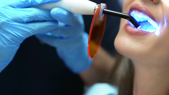 Dentist Using Ultraviolet Lamp