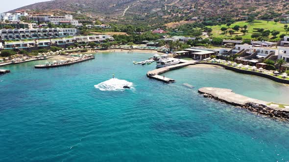 Aerial View of a Person Flyboarding in the Sea. Elounda, Crete, Greece