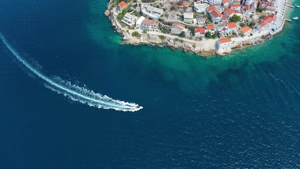 Primosten town, Croatia. View of the city from the air. Seascape with beach and old town.