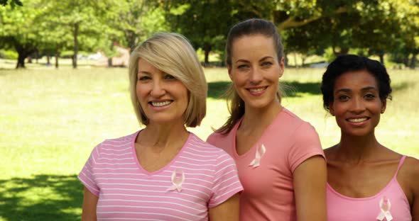 Diverse Happy Women Wearing Pink for Breast Cancer Awareness in the Park