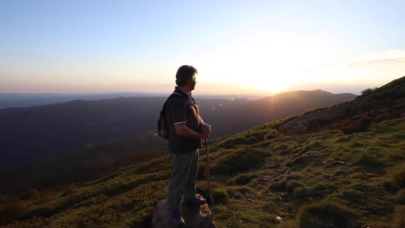 Senior man contemplating the sunset