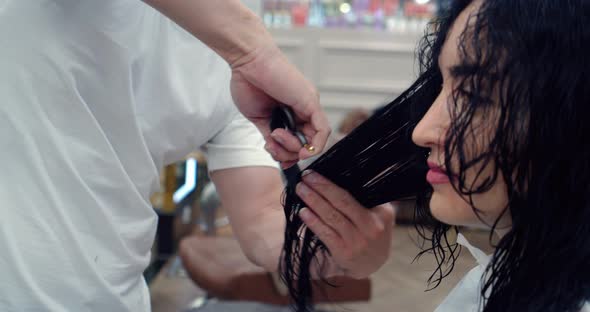 Man Hairdresser Combs His Hair