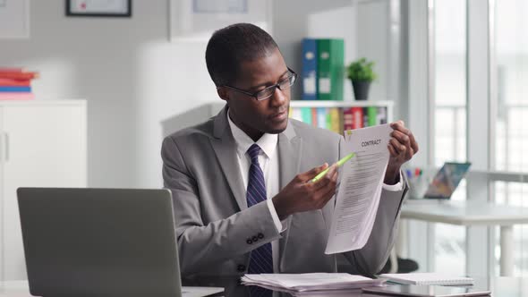 AfricanAmerican Sales Manager Discuss Contract with Client on Video Conference