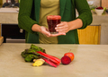 Woman holding a glass of red juice - PhotoDune Item for Sale