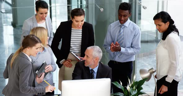 Group of business people appreciating their colleagues works