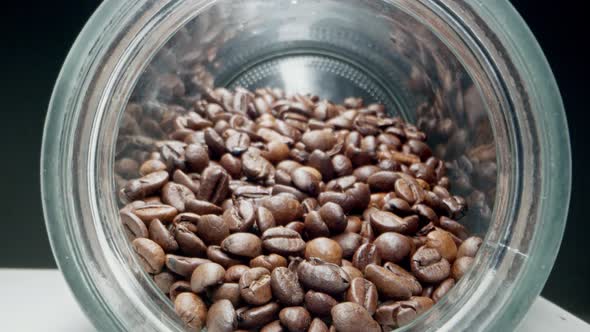 Slow Dolly in Footage Near Roasted Coffee Beans in Jar Freshly Brewed Coffee Beans Lie in Bottle