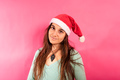 A young woman looks sideways at the camera with melancholy gestures in a Christmas - PhotoDune Item for Sale