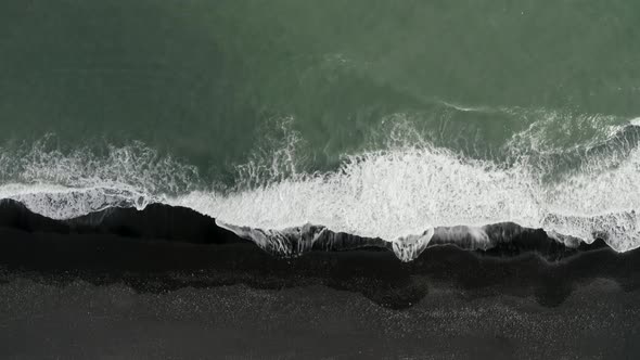 Top down view of a black volcanic beach in Iceland