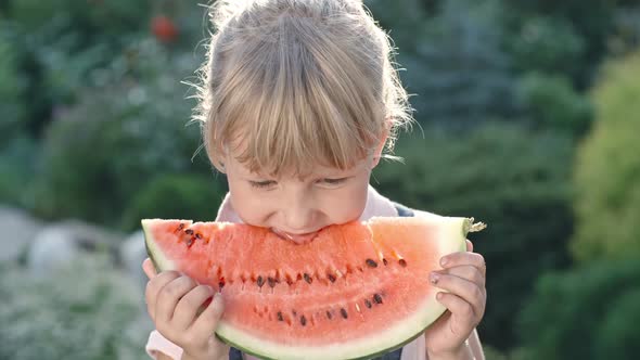 Little Girl Enjoying Watermelon