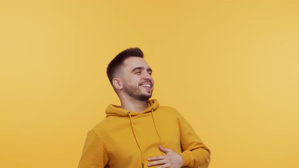 Expressive young man screaming and shouting over vibrant background.