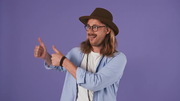 Longhaired Man in Casual Outfit Glasses Hat