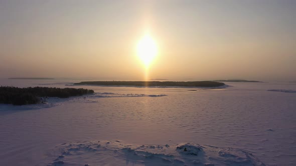 Frozen Kandalaksha Bay and Tree Islands on Winter Sunny Day