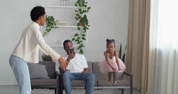 African Family Spends Time at Home Black Afro Mother Gives Command to Child Baby Little Daughter in