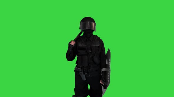 Riot Policeman Standing and Doing Nothing Waiting on a Green Screen Chroma Key