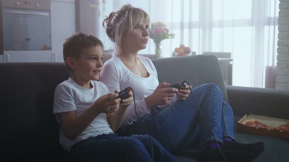 Happy Family Having Fun Playing Video Game Console