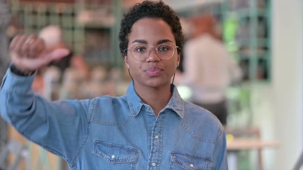 Portrait of Disappointed African Woman Doing Thumbs Down