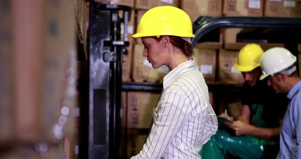 Warehouse Manager Scanning Barcodes on Boxes