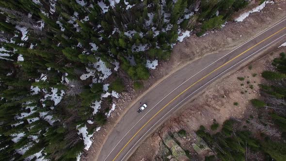 Flying view over a frozen forest in the mountains