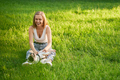 Smiling woman petting french bulldog in park. - PhotoDune Item for Sale