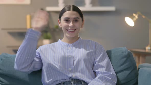 Portrait of Hispanic Woman Waving, Welcoming