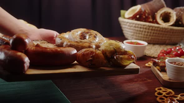 Putting Fried Sausages Closeup