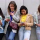 Multiethnic Group of Beautiful Young Female Friends Standing Against a Wall Using Mobile Smartphones - VideoHive Item for Sale