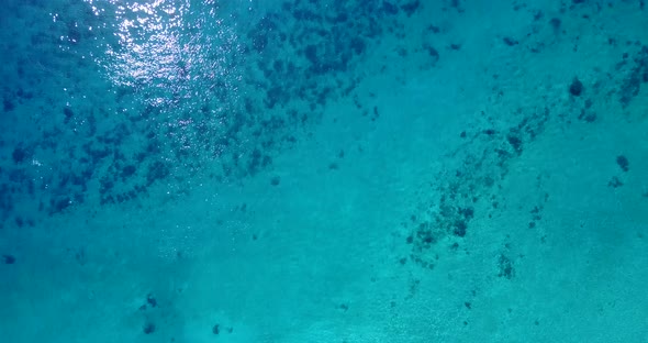 Luxury overhead abstract view of a sunshine white sandy paradise beach and turquoise sea background 