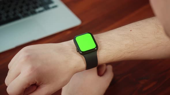 Man Student Using Smartwatch with Chroma Key Closeup