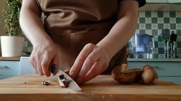 Woman Prepares Mushrooms in Home Kitchen