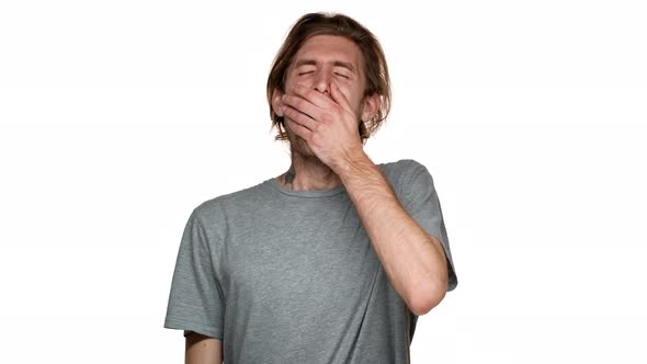 Portrait of Hairy Exhausted Man in Casual Tshirt Having Insomnia and Yawning After Sleepless Night