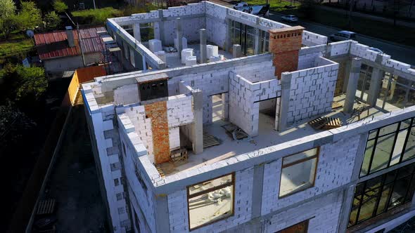 Building site of a house under construction made from white foam concrete blocks