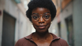 Close up beautiful African girl in glasses looking at camera out - PhotoDune Item for Sale