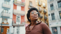 Dark-skinned girl in glasses looking inspired during walk around city. - PhotoDune Item for Sale