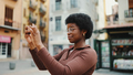 African American curly girl in glasses taking photo during walk - PhotoDune Item for Sale