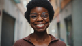 Close up cheerful African woman in glasses sincerely smiling at - PhotoDune Item for Sale