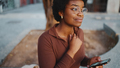 Beautiful African American girl in glasses using a smartphone on - PhotoDune Item for Sale