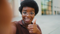 Close up Afro woman showing like gesture at camera taking selfie - PhotoDune Item for Sale