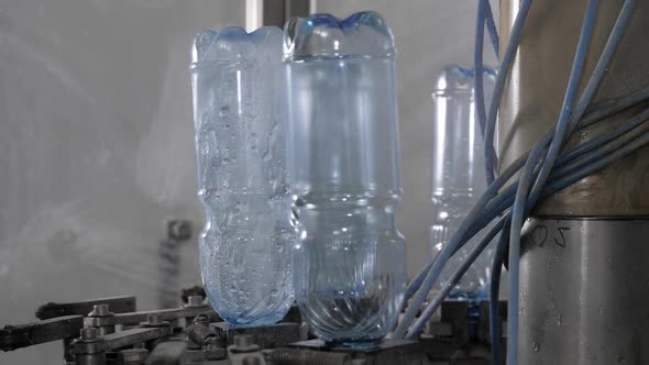 The Process of Rinsing Plastic Bottles Before They Go on Tap