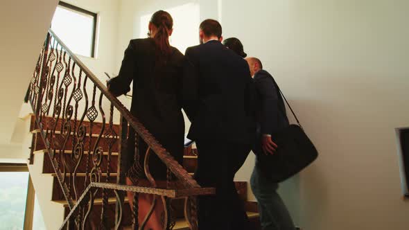 Business Workers Walking Up on Stairs