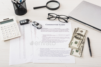 car, money, calculator, magnifier, laptop and