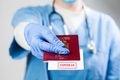 Doctor handing over immunity passport - PhotoDune Item for Sale